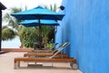 The chair on the pool terrace of Ã¢â¬â¹Ã¢â¬â¹Thailand with Blue Wall Royalty Free Stock Photo